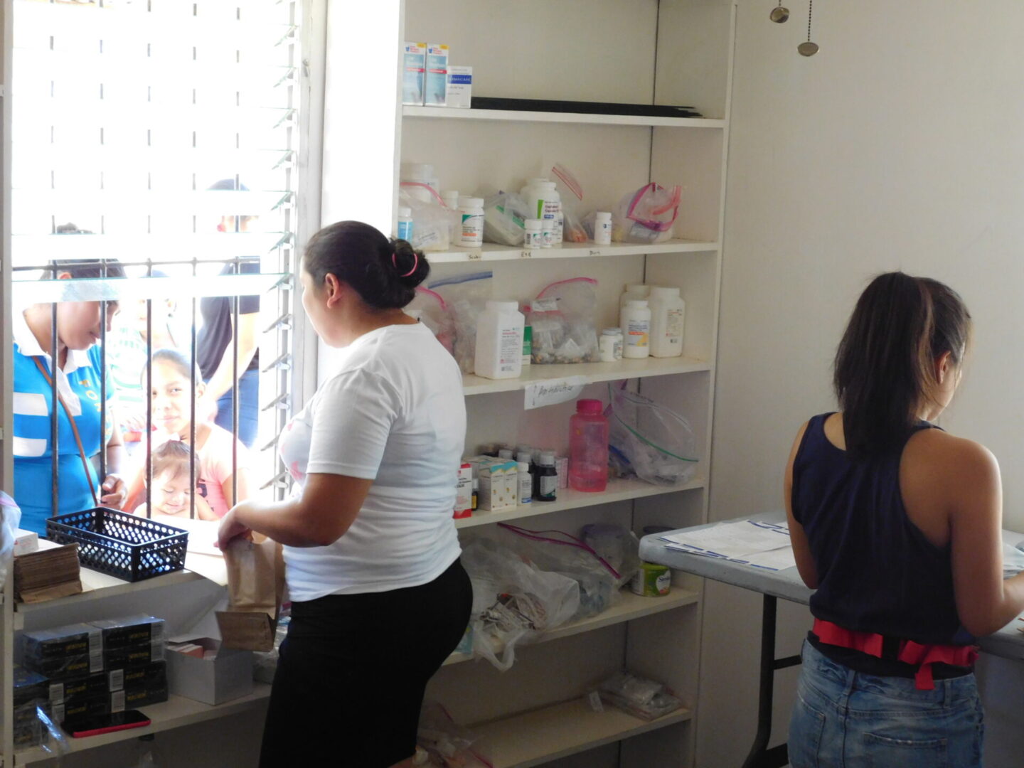 Two women managing the pharmacy